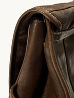 Songmont Mini Shan Backpack Drab - close-up of flap edge and contrast stitching