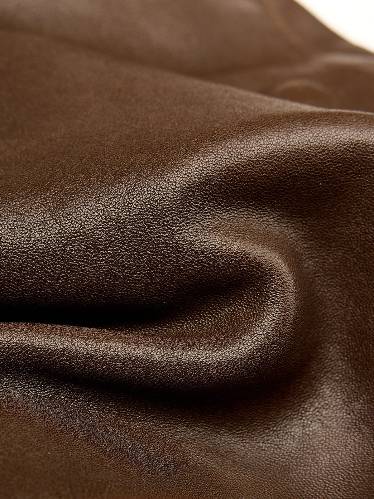 Songmont Mini Shan Backpack Drab - close-up of soft pebbled leather texture