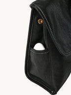 Songmont Mini Shan Backpack Onyx - side pocket close-up with stud and stitching