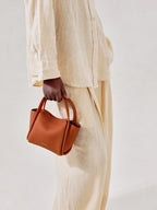 Songmont Mini Song Bag Brandy - carried by hand
