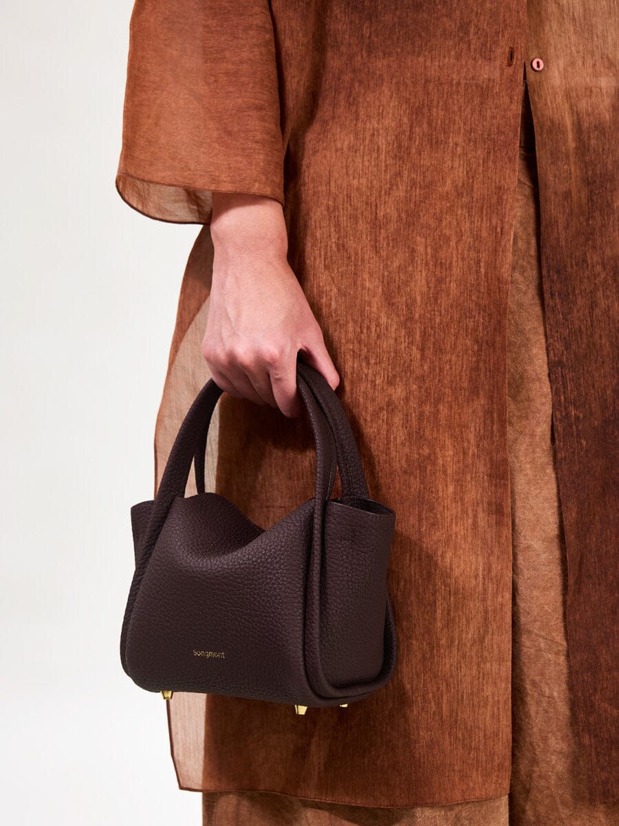 Songmont Mini Song Bag Burgundy - carried by hand