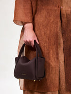 Songmont Mini Song Bag Burgundy - carried by hand