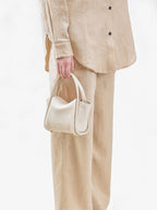 Songmont Mini Song Bag Ivory - carried by hand