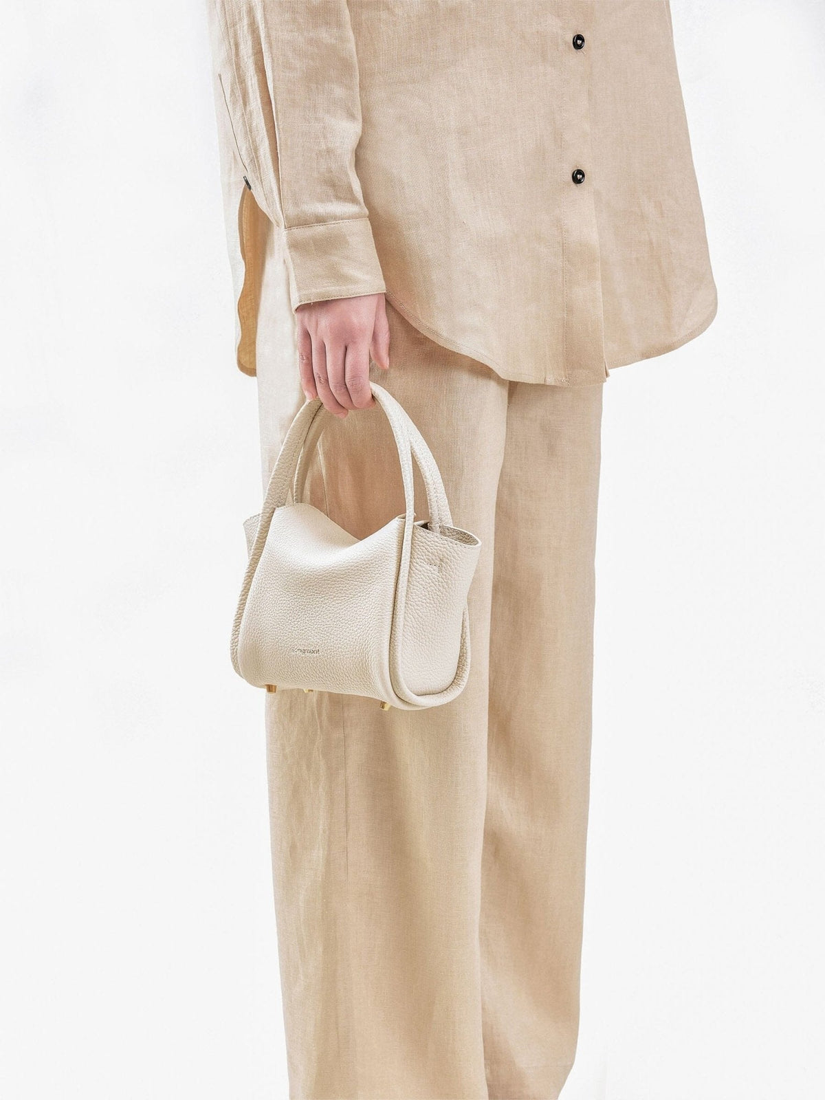 Songmont Mini Song Bag Ivory - carried by hand