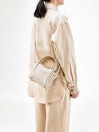 Songmont Mini Song Bag Ivory - worn cross-body