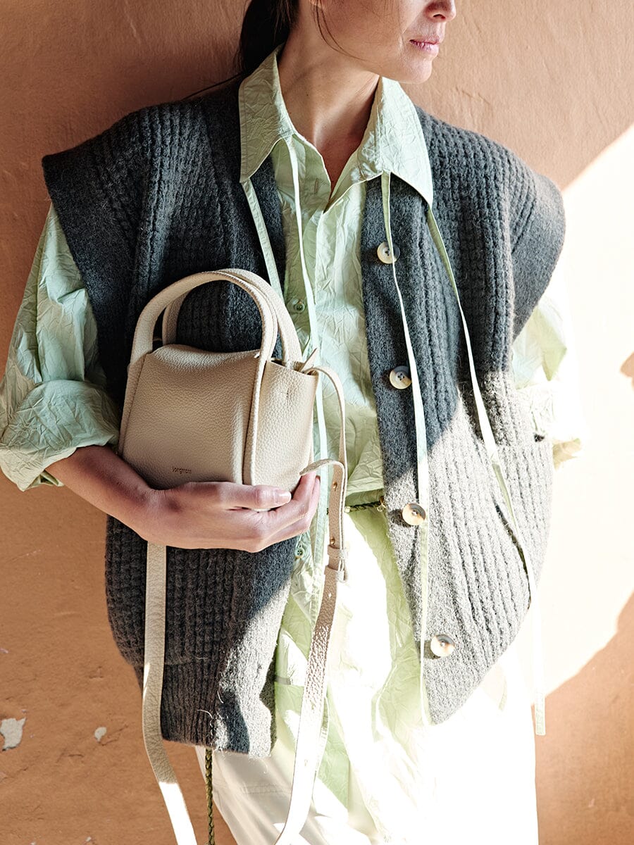 Songmont Mini Song Bag Ivory - carried by hand