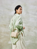 Songmont Mini Song Bag Ivory - carried by hand, full length