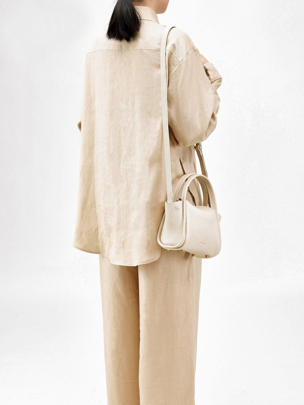 Songmont Mini Song Bag Ivory - worn cross-body, back view