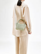 Songmont Mini Song Bag Jade - worn cross-body, side view