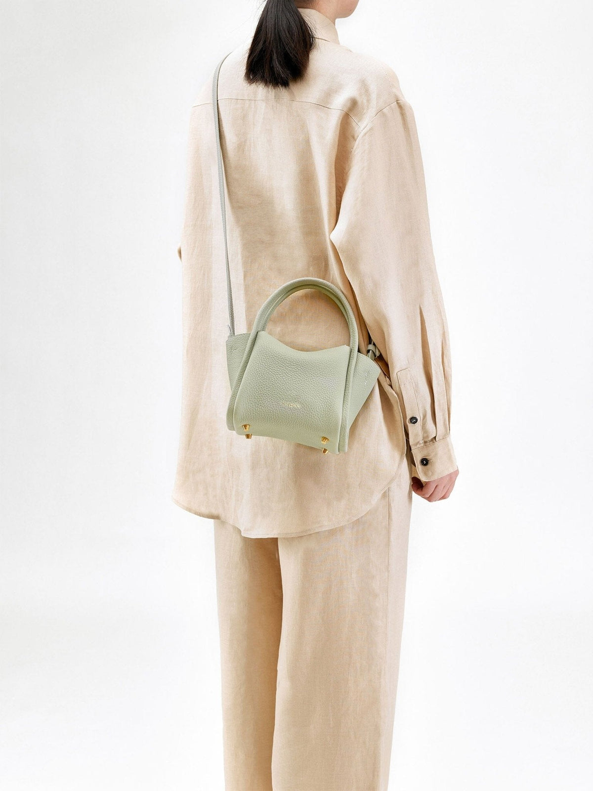 Songmont Mini Song Bag Jade - worn cross-body, side view