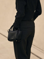Songmont Mini Song Bag Onyx - worn cross-body, back view