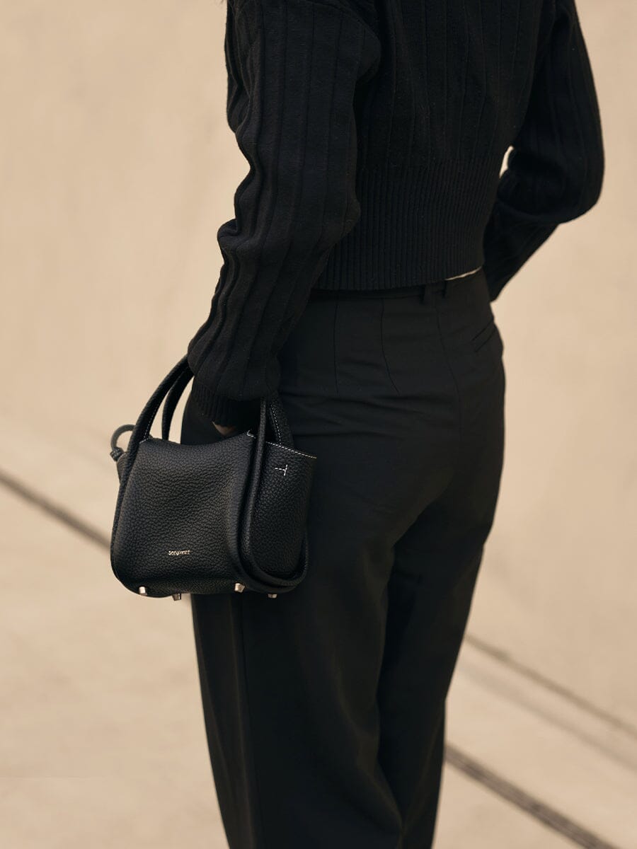 Songmont Mini Song Bag Onyx - worn cross-body, back view