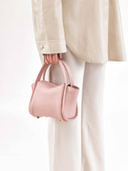 Songmont Mini Song Bag Pink - carried by hand