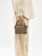 Songmont Mini Song Bag Taupe - carried by hand