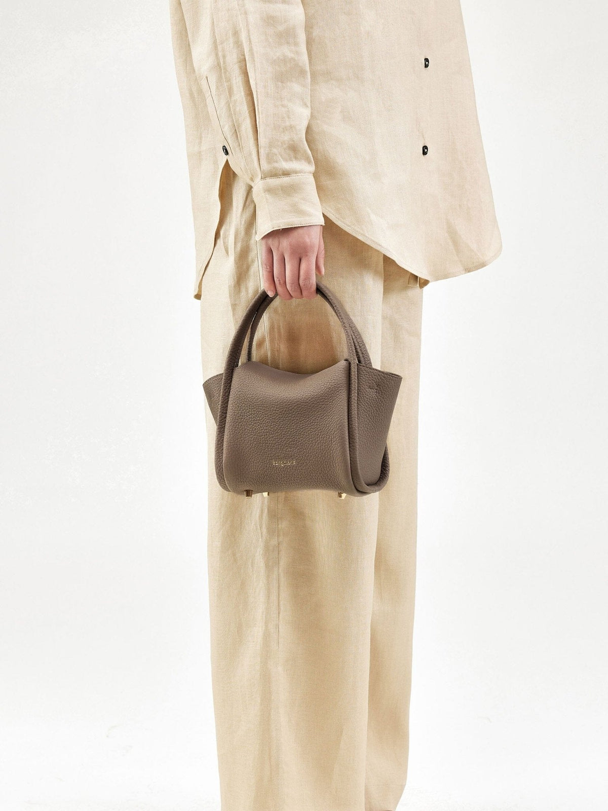 Songmont Mini Song Bag Taupe - carried by hand