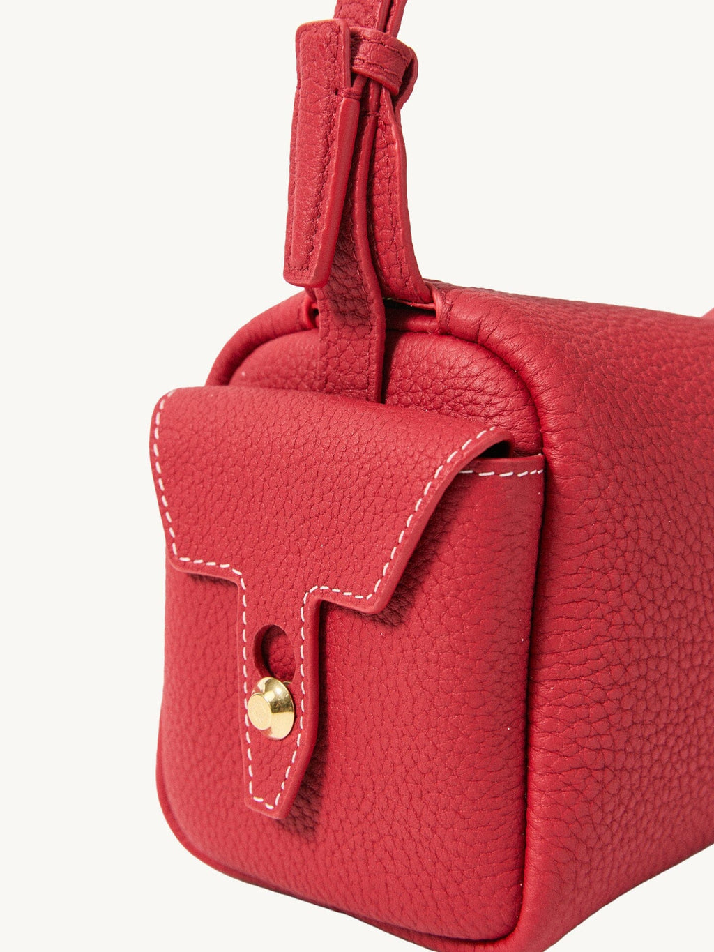 Songmont Mini Yore Camera Bag Lucky Red - close-up of the stitched end flap and metal stud
