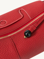 Songmont Mini Yore Camera Bag Lucky Red - close-up of the zip with black bead pull