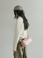 Songmont Mini Yore Camera Bag Peach - side view worn cross-body at the hip