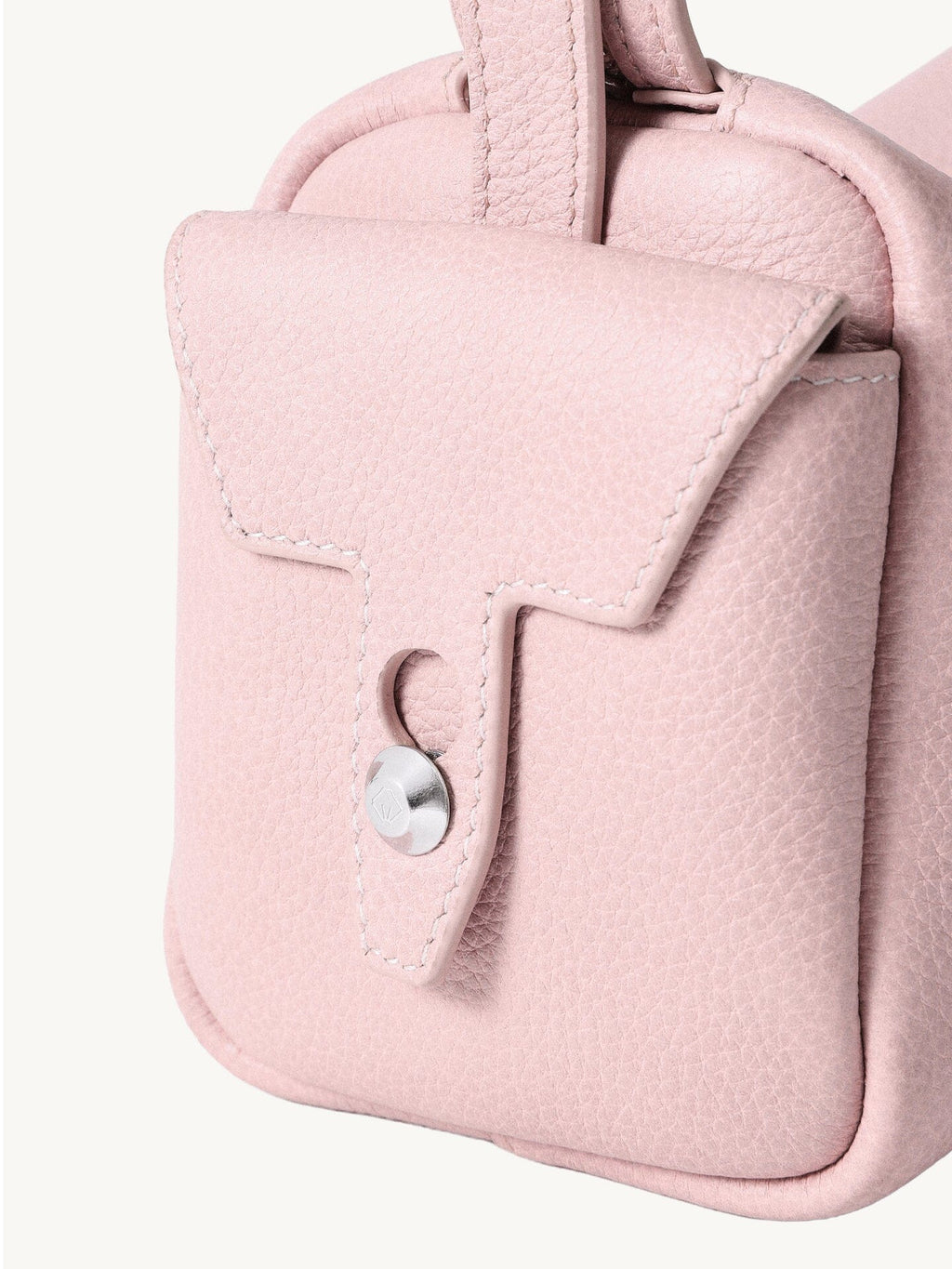 Songmont Mini Yore Camera Bag Peach - close-up of the stitched end flap and metal stud