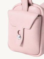 Songmont Mini Yore Camera Bag Peach - close-up of the stitched end flap and metal stud