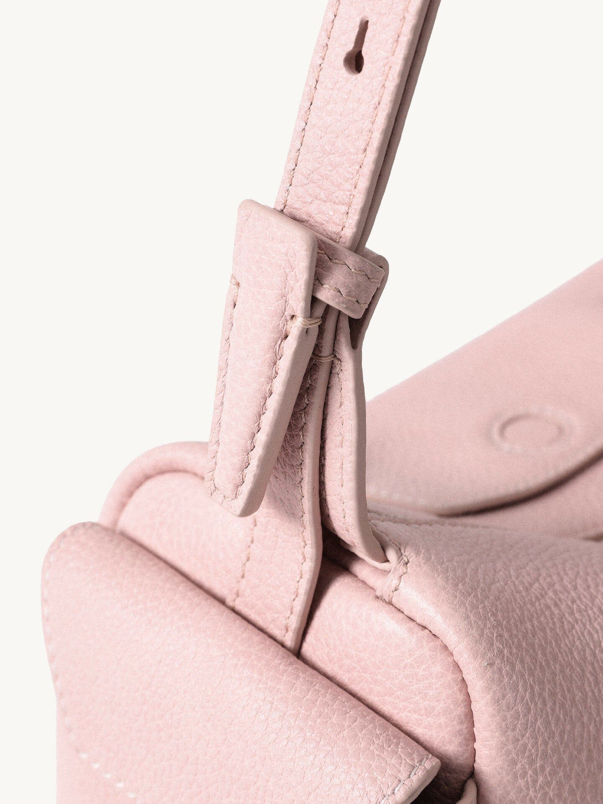 Songmont Mini Yore Camera Bag Peach - close-up of the strap tab and stitched flap