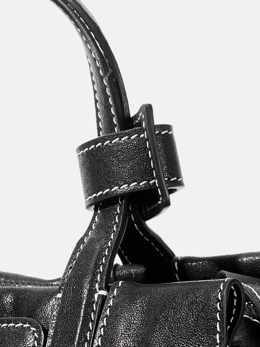 Songmont Mini Yore Duffle Bag Onyx - close-up of handle tab and contrast stitching