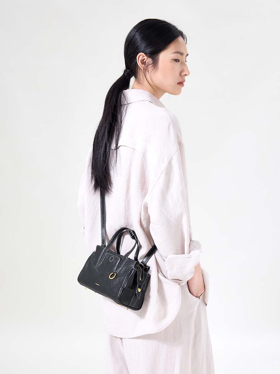 Songmont Mini Yore Duffle Bag Onyx - side view worn cross-body