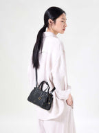 Songmont Mini Yore Duffle Bag Onyx - side view worn cross-body