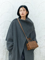 Songmont Mini Yore Duffle Bag Sandal - cross-body on a model in a grey coat