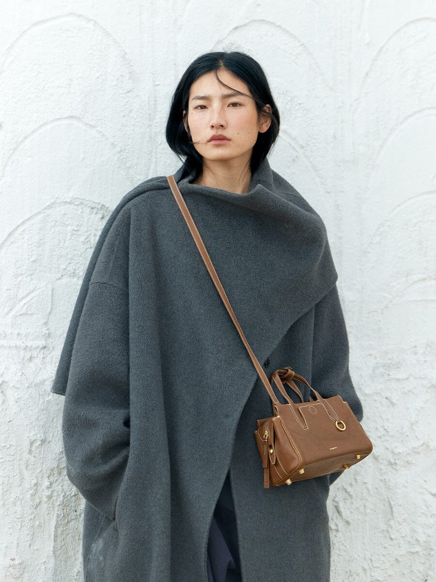 Songmont Mini Yore Duffle Bag Sandal - cross-body on a model in a grey coat