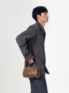 Songmont Mini Yore Duffle Bag Sandal - carried by the top handles, side profile