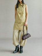 Songmont Mini Yore Toast Bag Ebony - carried in hand by the straps