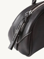 Songmont Mini Yore Toast Bag Ebony - zip end and leather close-up