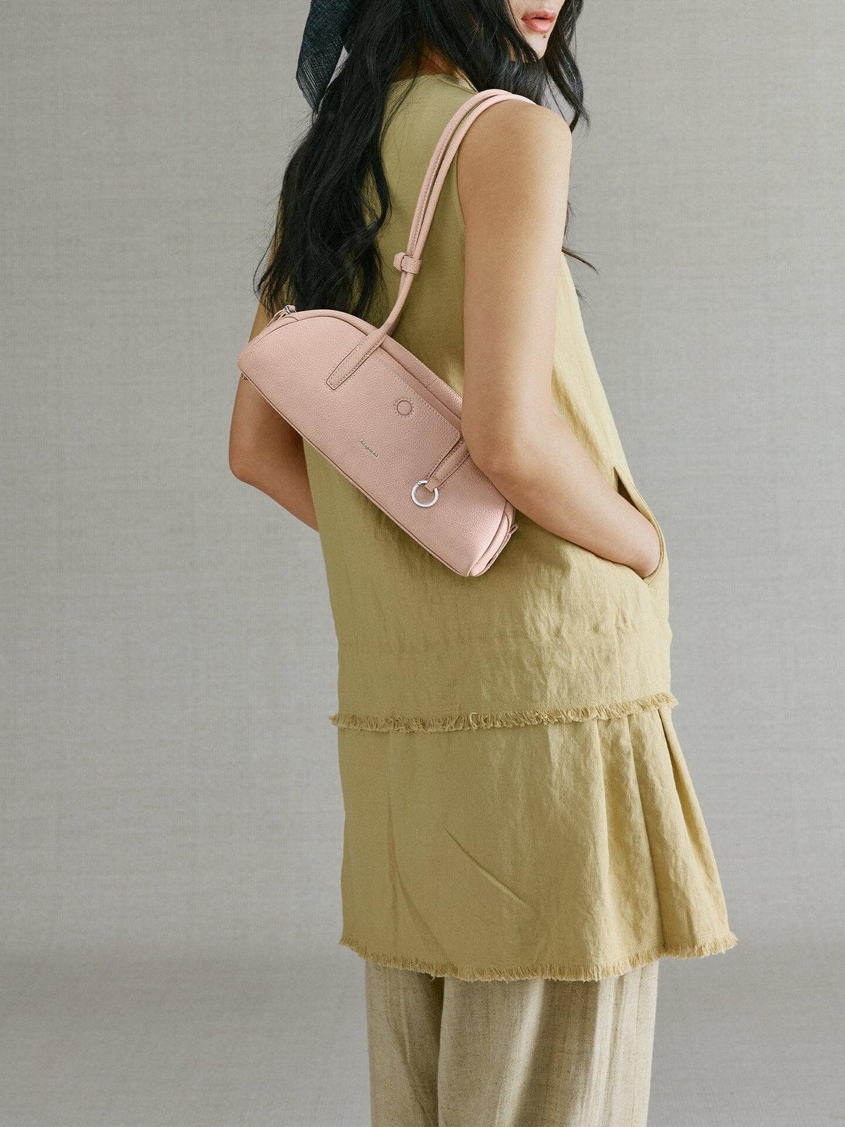 Songmont Mini Yore Toast Bag Peach - worn on the shoulder, side view