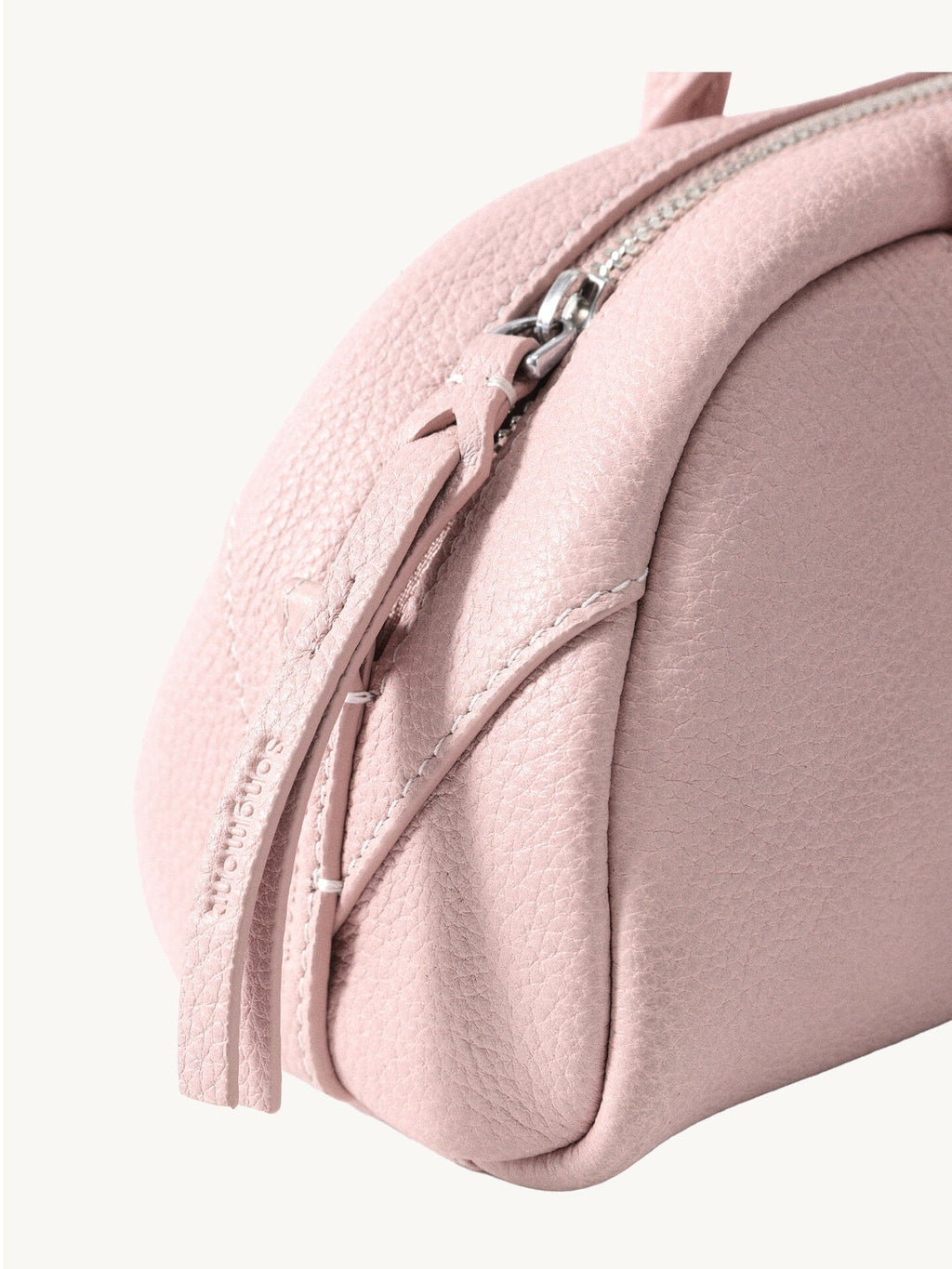 Songmont Mini Yore Toast Bag Peach - zip end and leather grain close-up