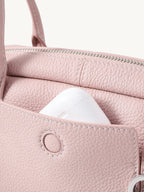 Songmont Mini Yore Toast Bag Peach - front panel with AirPods in the slip pocket
