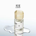 TO SUMMER Cedarwood Eau de Parfum bottle on a reflective surface