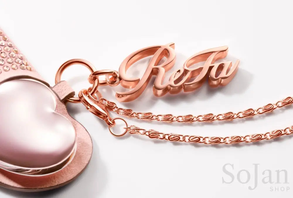 ReFa AIRA CASE Jewel logo charm and chain closeup