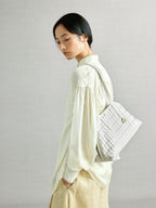 Songmont Lattice Shellseeker Bag Cloud - worn on the shoulder