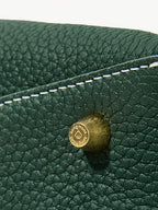 Songmont Small Drippy Roof Bag Emerald - close-up of gold stud on pebbled leather