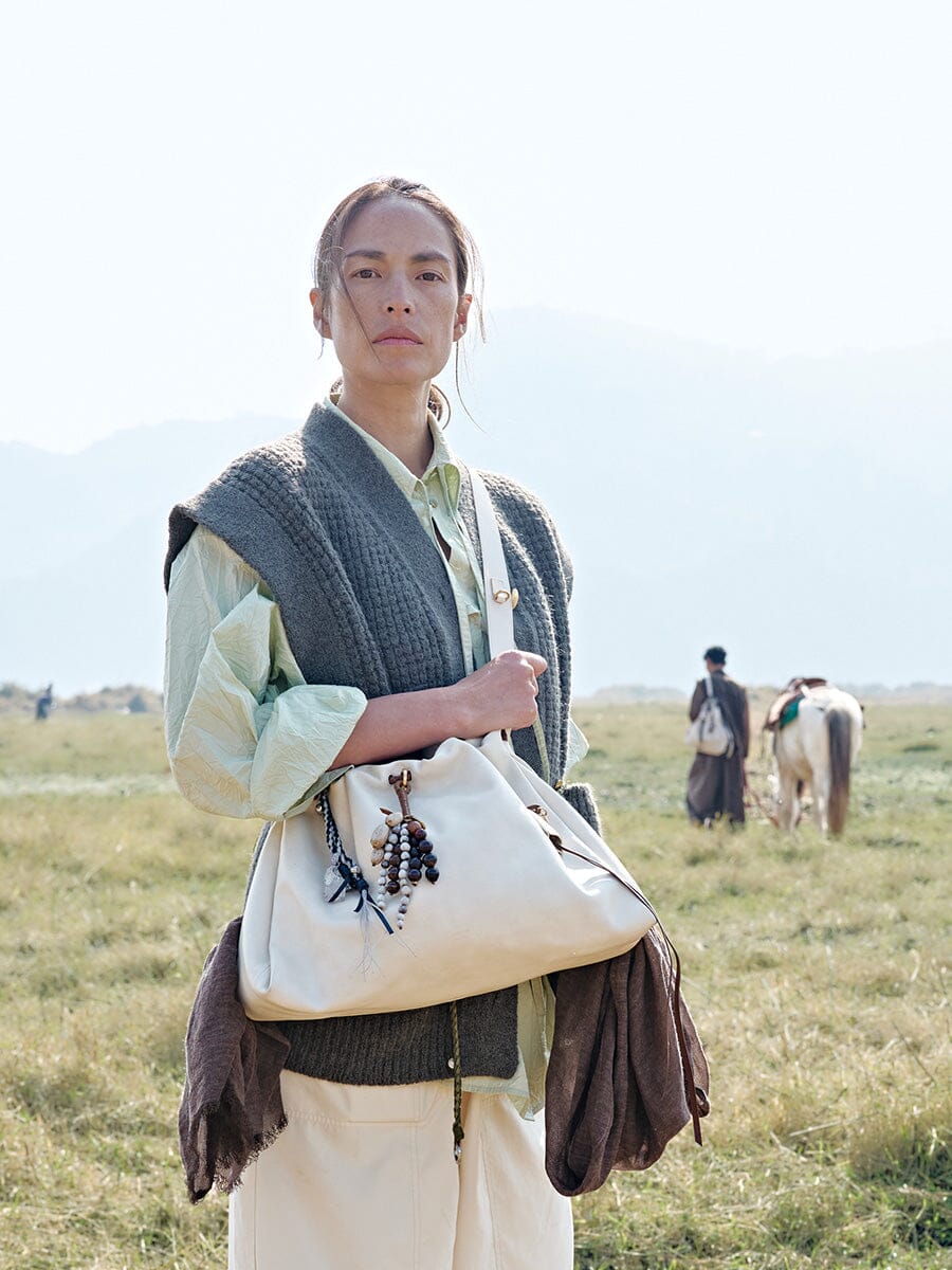 Songmont Small Gather Bag Cloud - worn on the shoulder outdoors