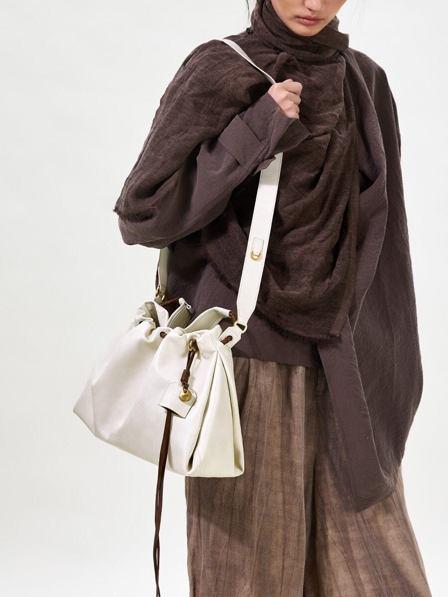 Songmont Small Gather Bag Cloud - worn cross-body, front view