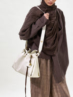 Songmont Small Gather Bag Cloud - worn cross-body, front view