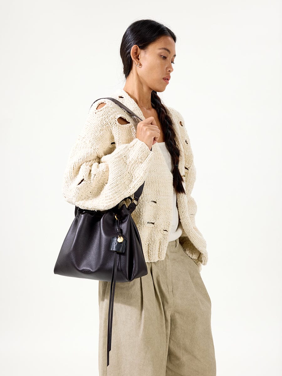 Songmont Small Gather Bag Ebony - worn cross-body, front view