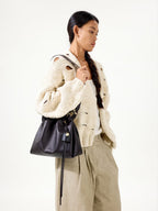 Songmont Small Gather Bag Ebony - worn cross-body, front view