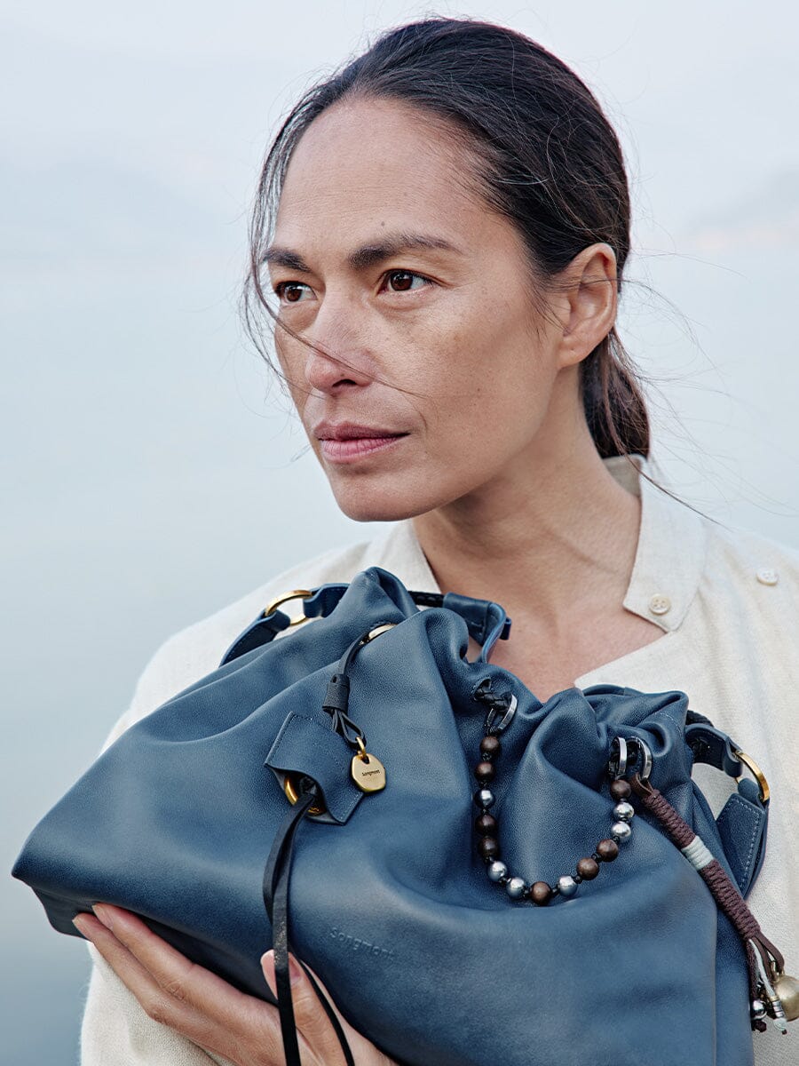 Songmont Small Gather Bag Navy - held close, front view