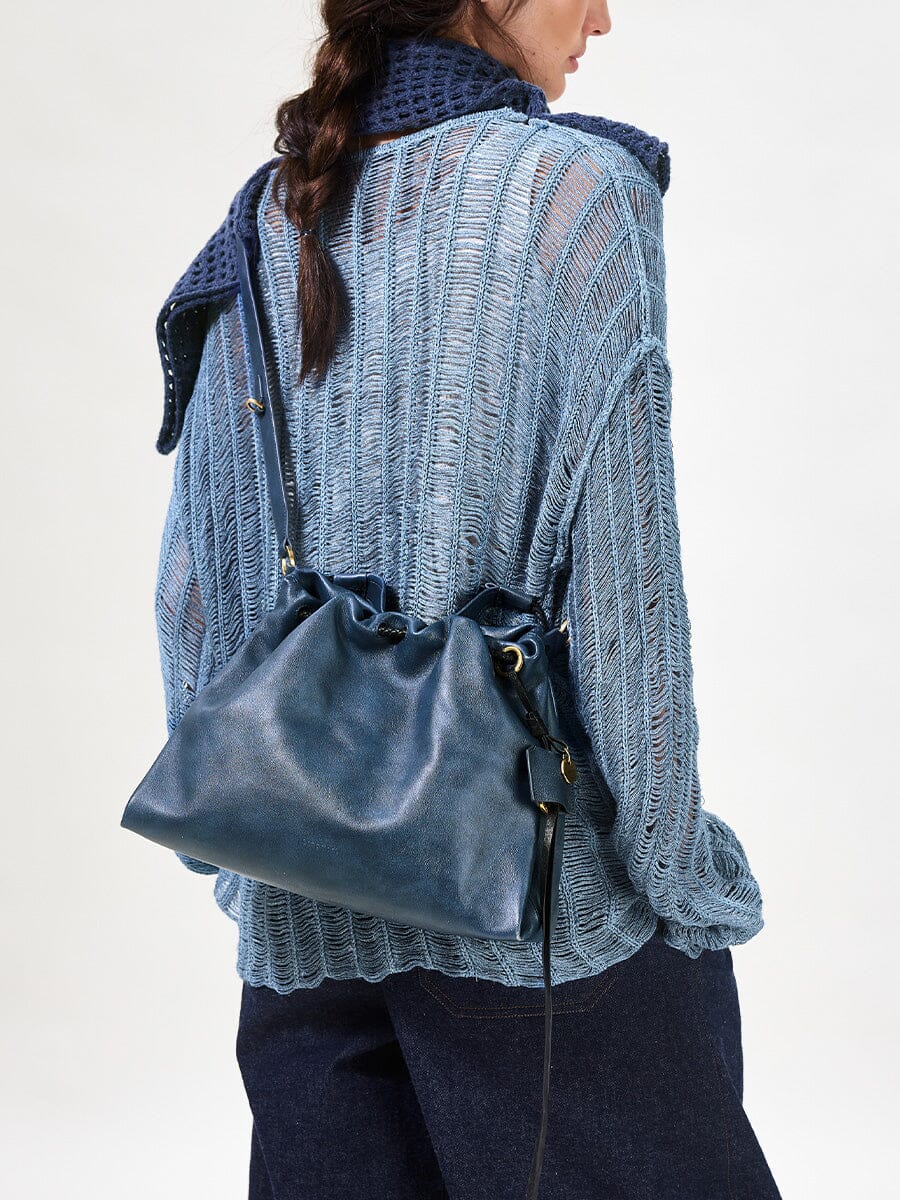 Songmont Small Gather Bag Navy - worn cross-body, back view