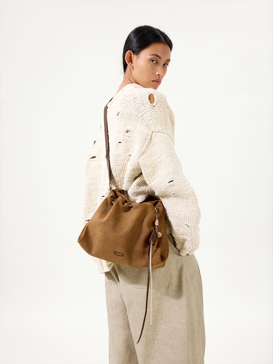 Songmont Small Gather Bag Ochre Suede - worn cross-body, side view