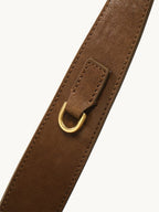 Songmont Small Gather Bag Ochre Suede - close-up of the strap and gold D-ring