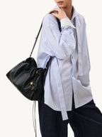 Songmont Small Gather Bag Onyx - worn on the shoulder, side view